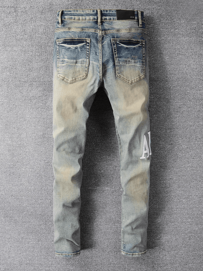 Washed Blue Ripped Writing Jeans